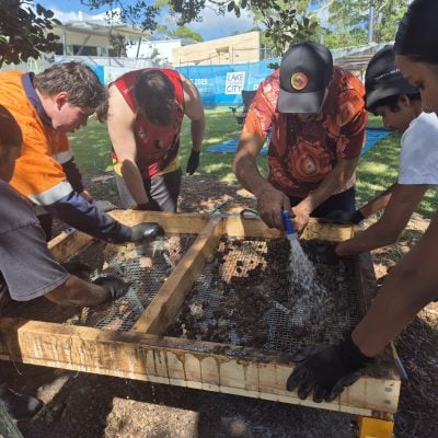bindelong aboriginal corporation team sifting soil